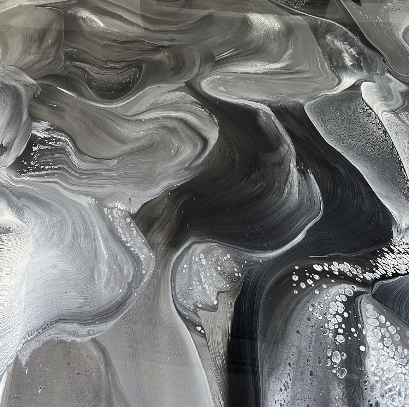 Black, silver, and white metallic epoxy movement