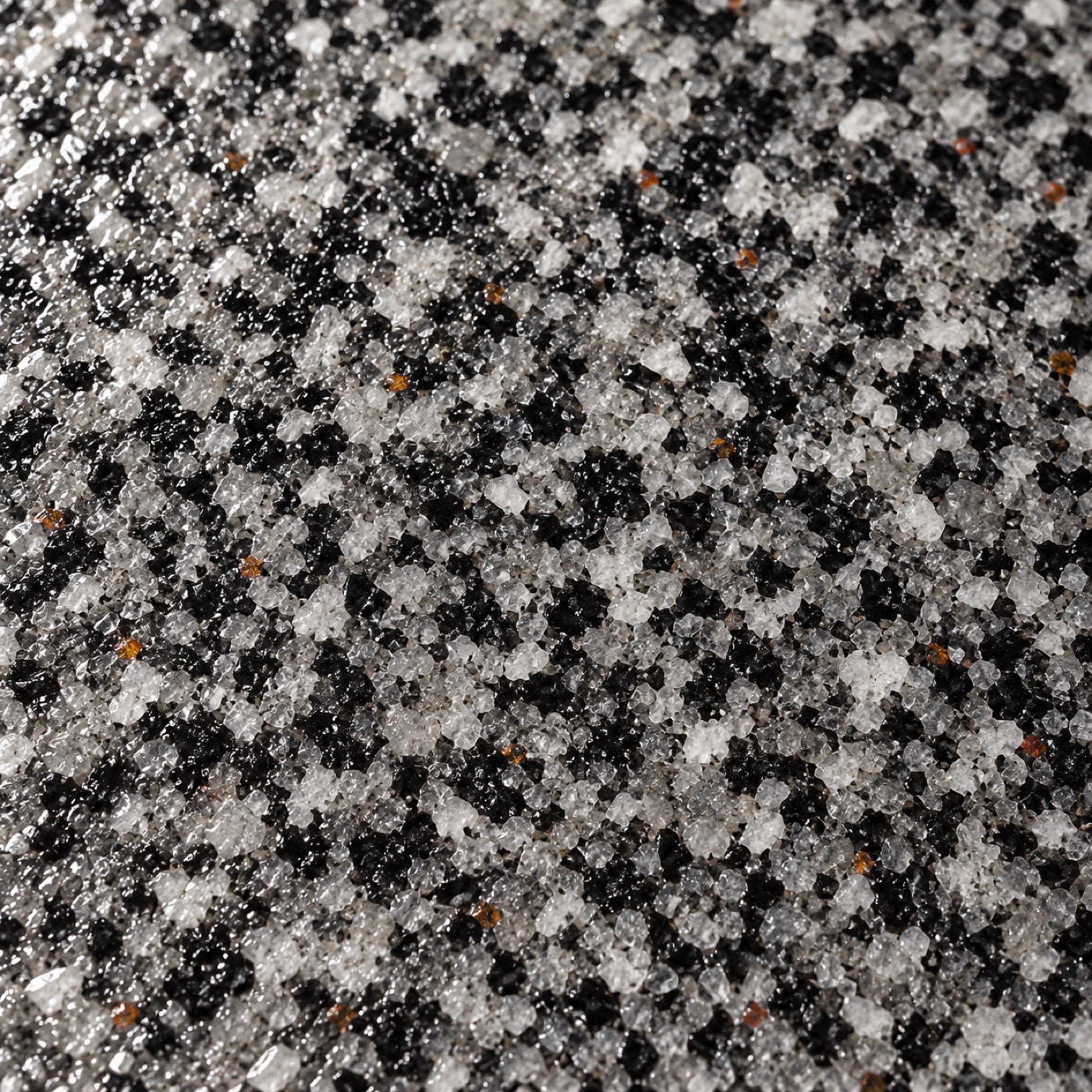 Detailed black, silver, and white quartz coating aggregate